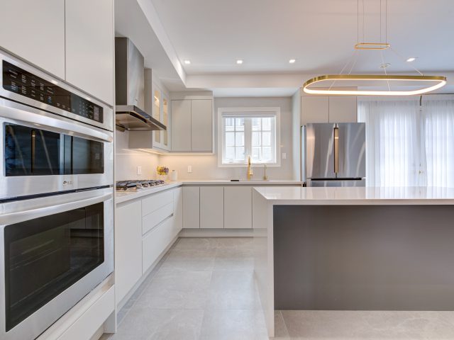 kitchen with island with whiter cabinets